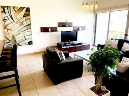 Sleek & Cozy Apartment with Pool & Patio In Abdoun - image 12